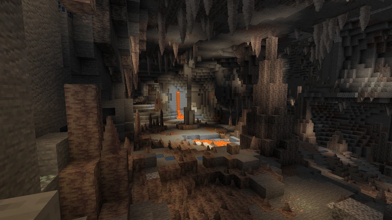 A Minecraft dripstone cave with stone pillars and a lava pool